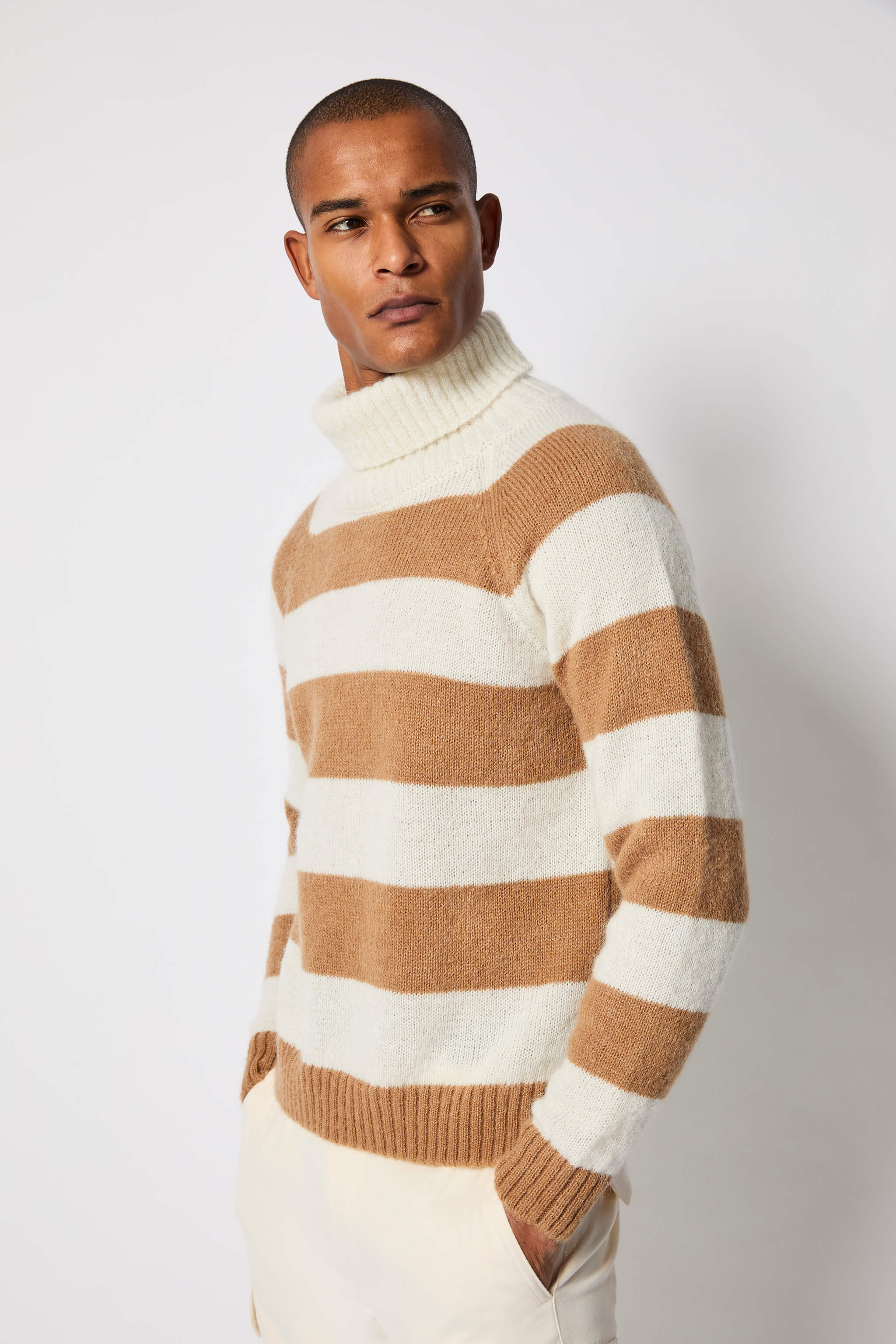 Striped turtleneck in white and camel