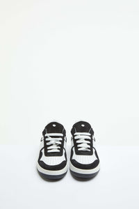 White basketball sneaker with contrast details black